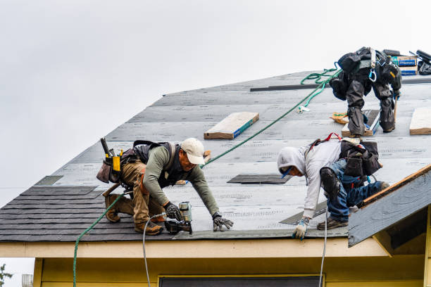 Professional Gutter Installation technician working in North Pembroke, MA